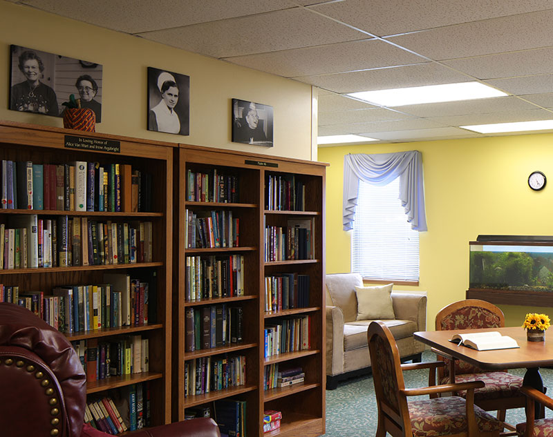Multiple large bookshelves stocked with books in Madison, Virginia nursing home.